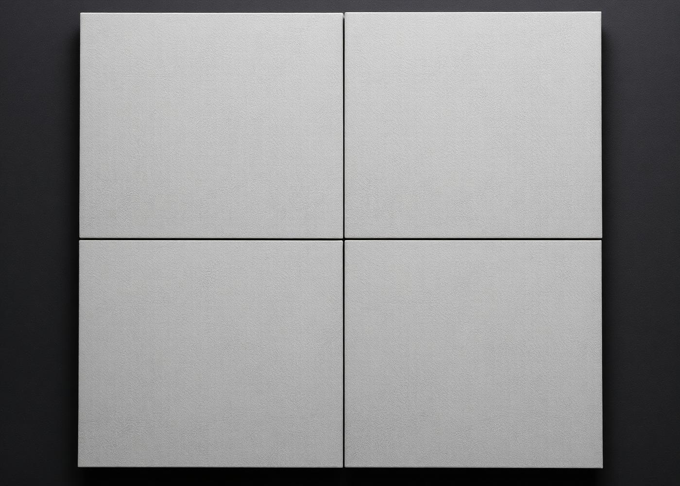 Four cool mid-grey Shahabad limestone tiles laid together, honed finish, showing fine grain